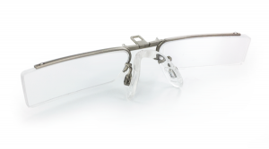 A rectangular clip-on pair of prescription lenses with a small metal frame and nose pad.