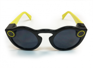 Pair of Snapchat Spectacles smart glasses with a black and yellow custom frame.